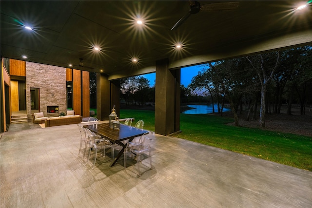 view of patio with a water view