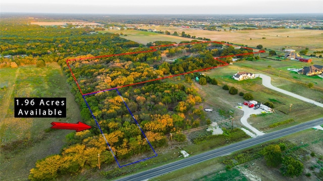 birds eye view of property with a rural view