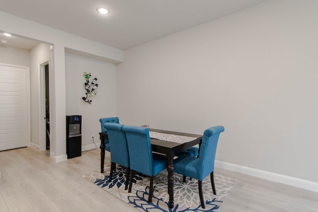 dining area with light hardwood / wood-style floors