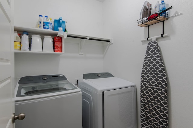 washroom featuring washer and clothes dryer