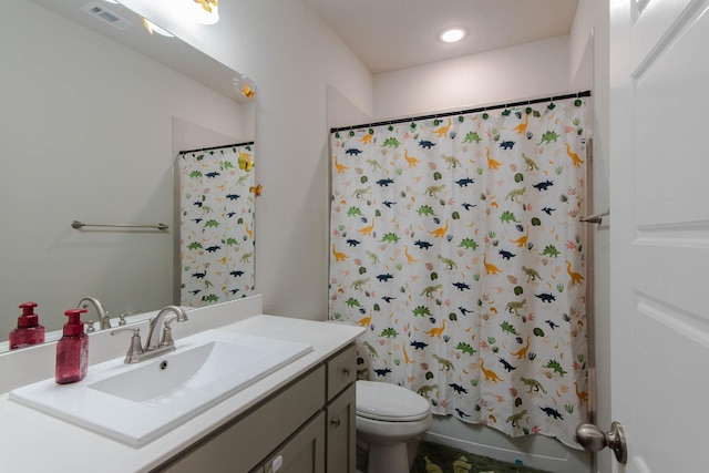 full bathroom featuring toilet, vanity, and shower / bathtub combination with curtain