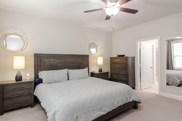 bedroom featuring light carpet and ceiling fan