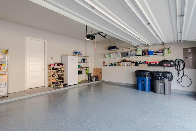 garage featuring a garage door opener and electric panel