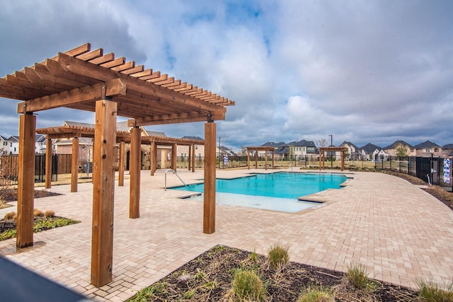 view of swimming pool featuring a patio and a pergola