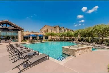 view of swimming pool with a patio