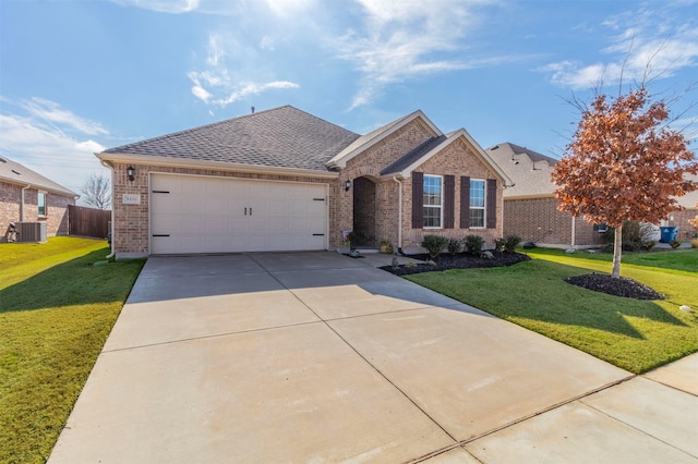 view of front of home with a garage, central air condition unit, and a front lawn