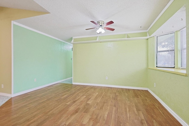 1806 Duck Creek Rd, Sanger, TX 76266 - unfurnished room with wood finished floors, a textured ceiling, crown molding, and a ceiling fan