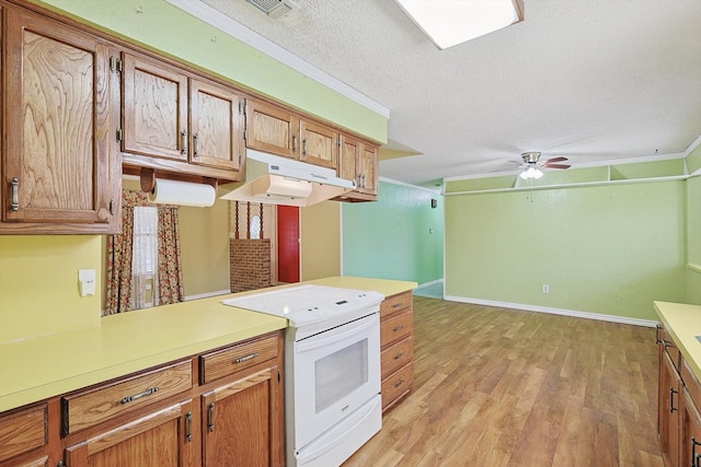 1806 Duck Creek Rd, Sanger, TX 76266 - kitchen featuring under cabinet range hood, white range with electric stovetop, light countertops, light wood-style floors, and a textured ceiling