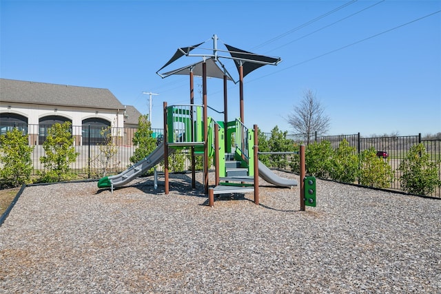 communal playground featuring fence