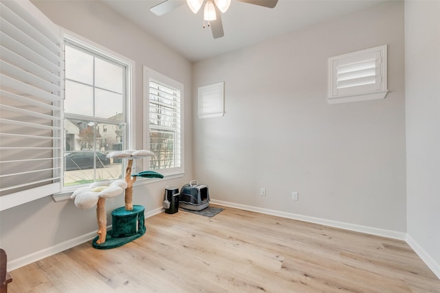 spare room featuring ceiling fan and light hardwood / wood-style floors