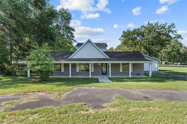 view of front of home with covered porch and a front yard