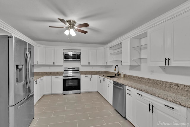 10553 White Oak Dr, Keithville, LA 71047 - kitchen with white cabinetry, sink, light stone countertops, and appliances with stainless steel finishes