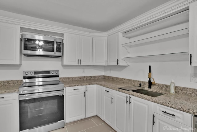 10553 White Oak Dr, Keithville, LA 71047 - kitchen featuring sink, light tile patterned floors, appliances with stainless steel finishes, white cabinetry, and light stone countertops