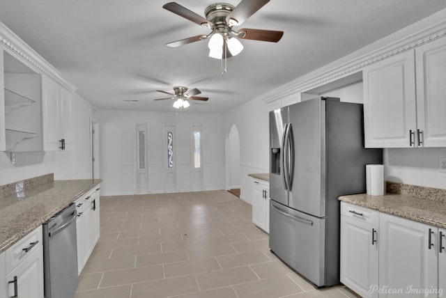 10553 White Oak Dr, Keithville, LA 71047 - kitchen featuring stainless steel appliances, light stone countertops, white cabinets, and ceiling fan