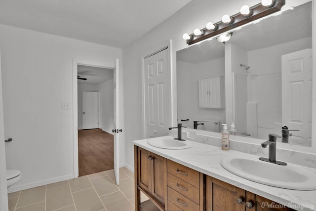 10553 White Oak Dr, Keithville, LA 71047 - bathroom featuring tile patterned flooring, vanity, a shower, and toilet