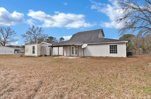 10553 White Oak Dr, Keithville, LA 71047 - back of property featuring a storage shed, a lawn, a patio, and central air condition unit
