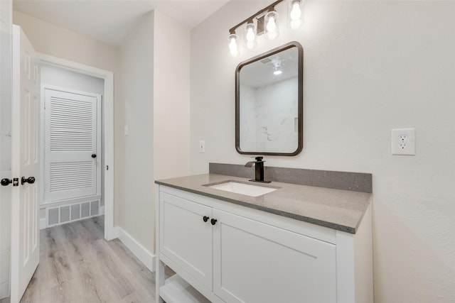 bathroom featuring vanity and hardwood / wood-style flooring