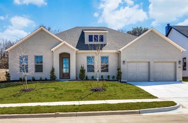 782 Sterling Dr, Benbrook, TX 76126 - view of front facade with brick siding, an attached garage, driveway, and a front yard