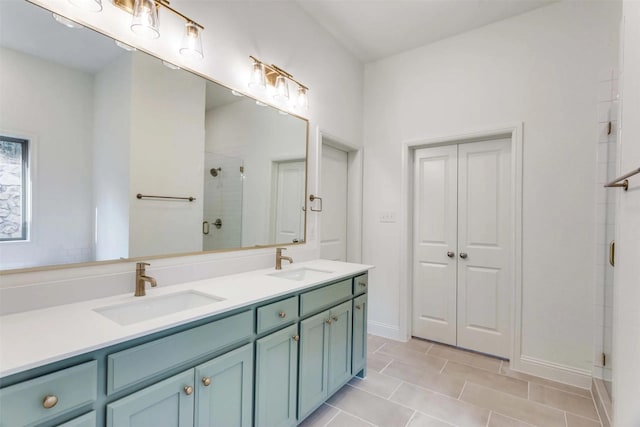782 Sterling Dr, Benbrook, TX 76126 - full bath with a shower stall, double vanity, baseboards, and tile patterned flooring