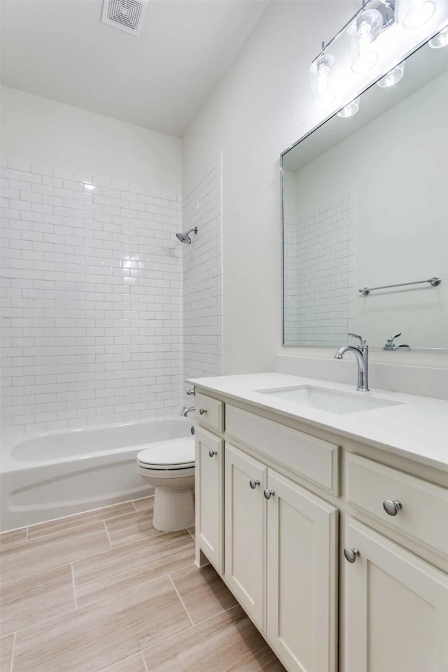 782 Sterling Dr, Benbrook, TX 76126 - full bathroom with vanity, toilet, shower / bath combination, and wood finished floors
