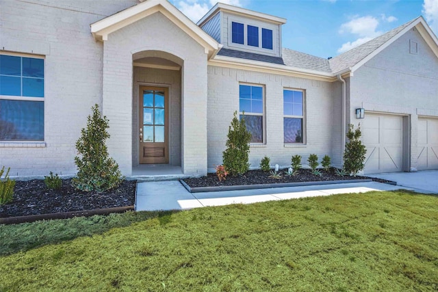 782 Sterling Dr, Benbrook, TX 76126 - property entrance featuring a yard, an attached garage, and brick siding