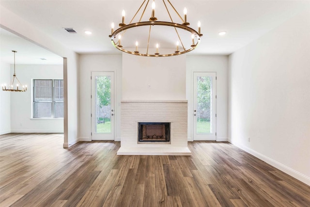782 Sterling Dr, Benbrook, TX 76126 - unfurnished living room with a chandelier, plenty of natural light, baseboards, and recessed lighting