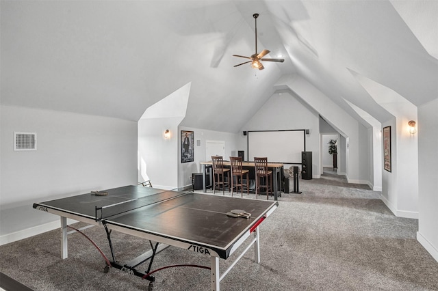 recreation room with baseboards, visible vents, a ceiling fan, lofted ceiling, and carpet floors