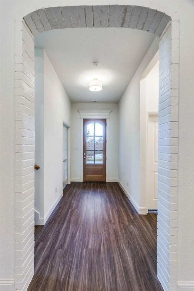 interior space with dark hardwood / wood-style flooring