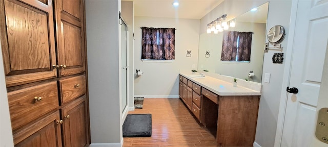 bathroom featuring hardwood / wood-style flooring and vanity