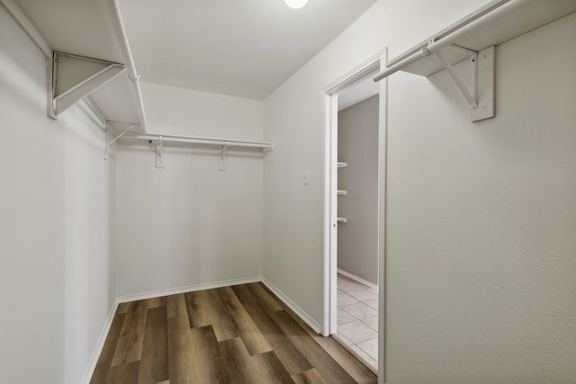 spacious closet with wood finished floors