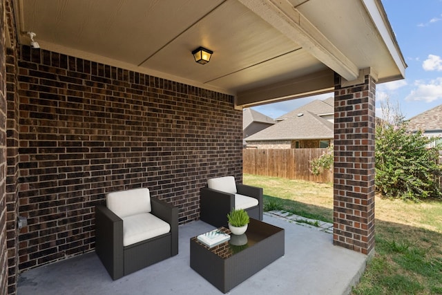 view of patio featuring fence and an outdoor living space