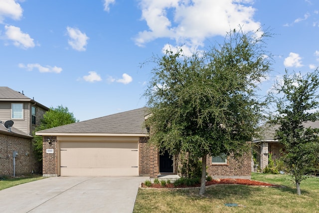 view of front of house with a garage, a front yard, concrete driveway, and brick siding