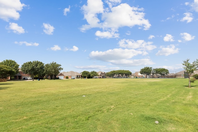 view of yard featuring fence and a residential view