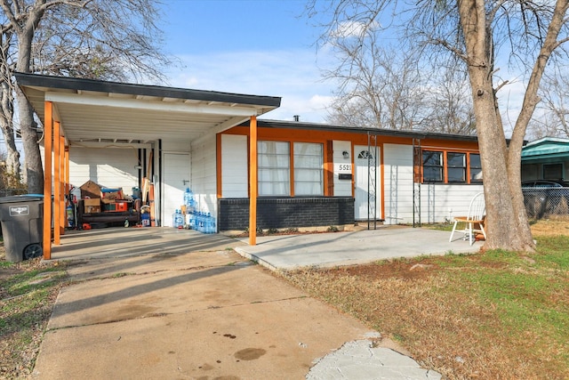 ranch-style home with a carport