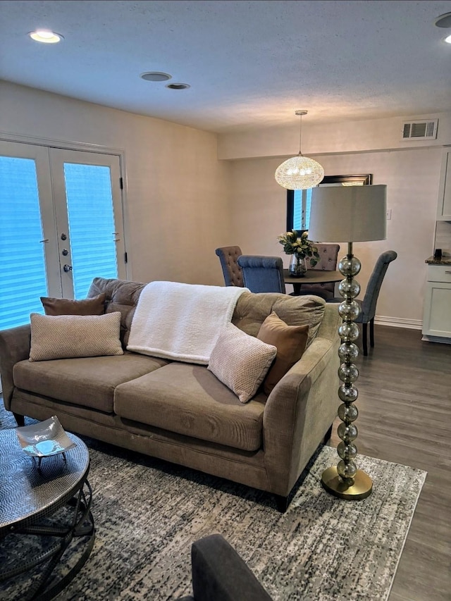 2722 Knight St Unit 316C, Dallas, TX 75219 - living area featuring french doors, dark wood-type flooring, baseboards, recessed lighting, and a chandelier
