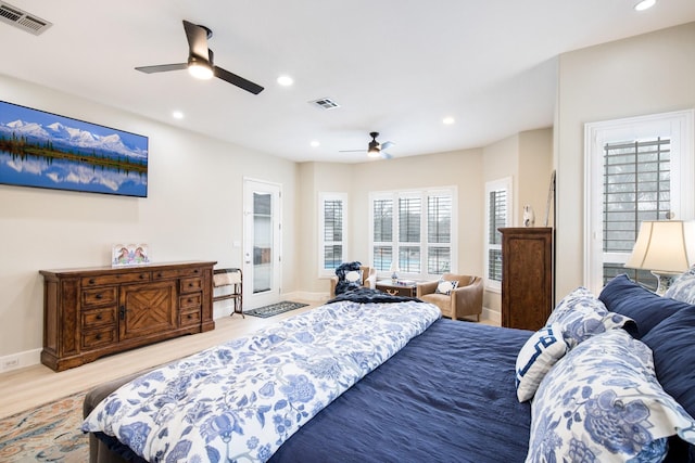 bedroom featuring ceiling fan, light hardwood / wood-style floors, and access to outside