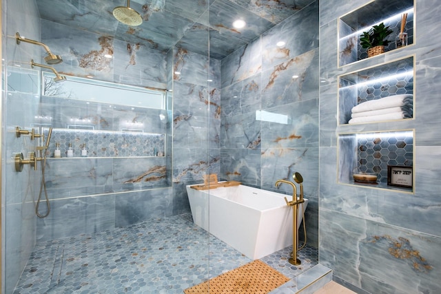 bathroom with separate shower and tub