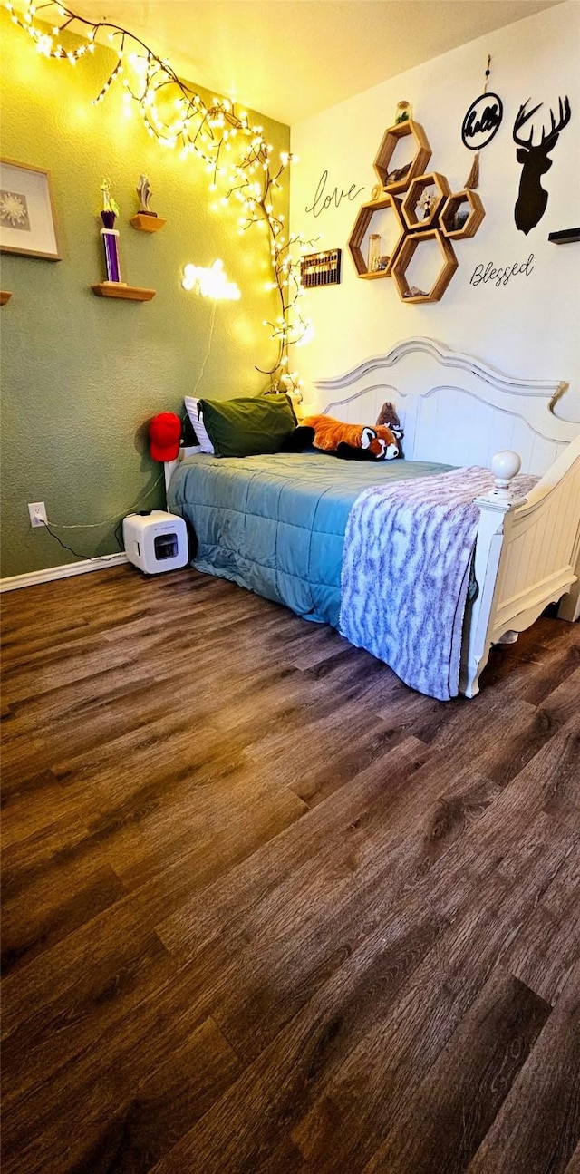 bedroom featuring dark hardwood / wood-style flooring