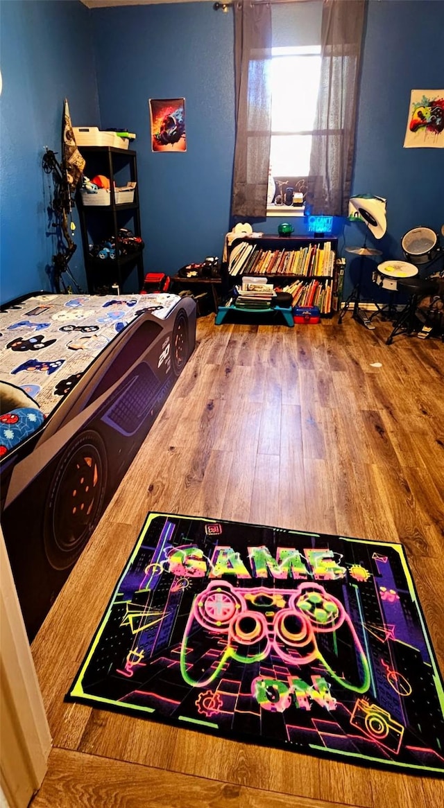 bedroom featuring wood-type flooring