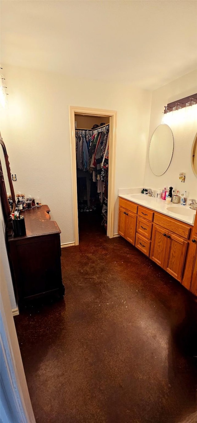 bathroom with vanity and concrete floors