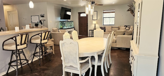 dining space featuring ceiling fan