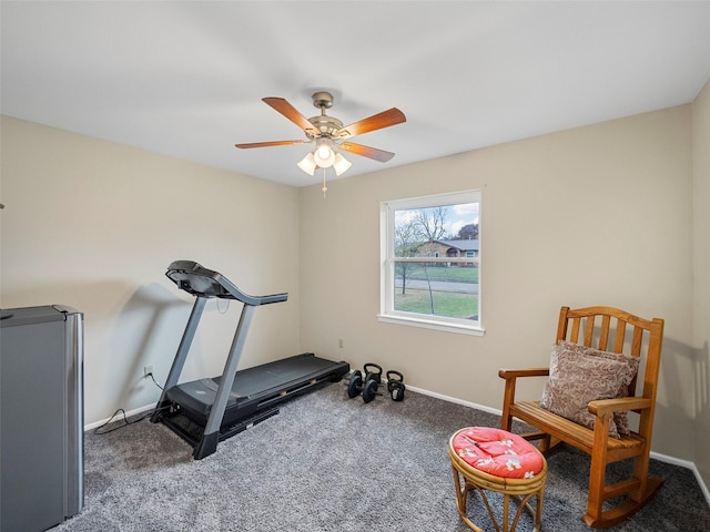 workout area with ceiling fan and carpet flooring