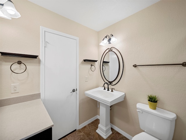 bathroom featuring tile patterned floors and toilet