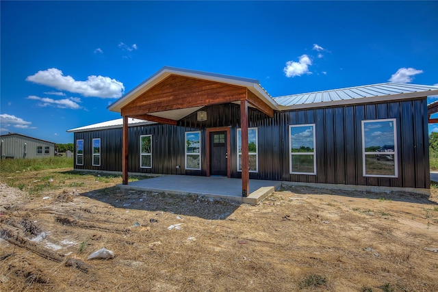 4340 Fm 1563, Wolfe City, TX 75496 - back of property with metal roof and board and batten siding