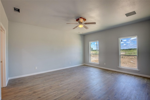 4340 Fm 1563, Wolfe City, TX 75496 - empty room featuring wood finished floors, visible vents, baseboards, and ceiling fan