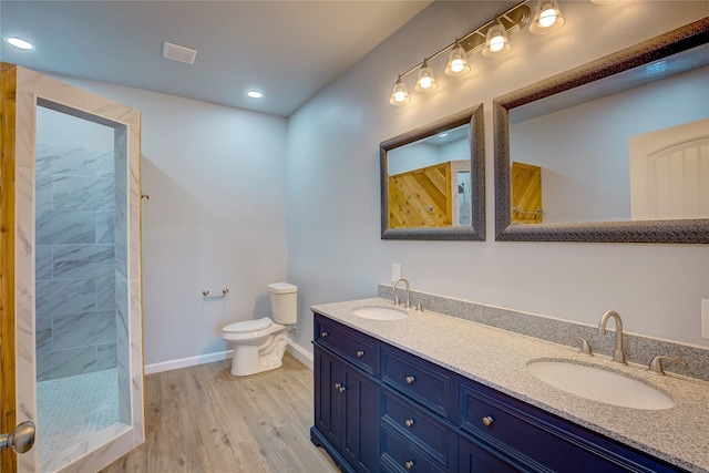 4340 Fm 1563, Wolfe City, TX 75496 - full bath with toilet, a sink, tiled shower, and wood finished floors