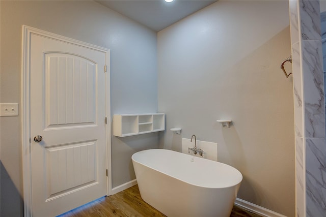 4340 Fm 1563, Wolfe City, TX 75496 - full bath featuring a freestanding tub, baseboards, and wood finished floors