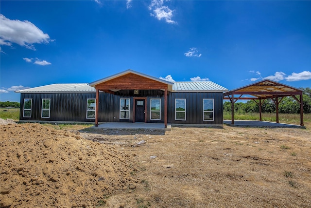 4340 Fm 1563, Wolfe City, TX 75496 - rear view of house featuring metal roof and a standing seam roof