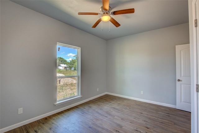 4340 Fm 1563, Wolfe City, TX 75496 - spare room featuring baseboards, wood finished floors, and a ceiling fan