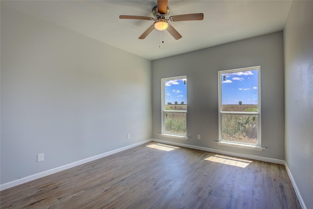4340 Fm 1563, Wolfe City, TX 75496 - spare room with baseboards, wood finished floors, and a ceiling fan